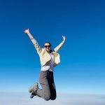 Person jumping against clear blue sky in kilimanjaro